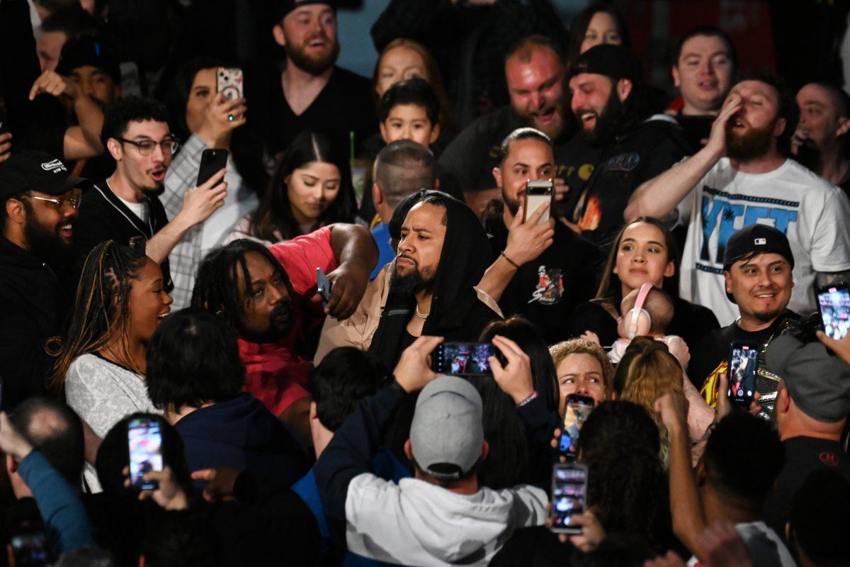 Jimmy Uso walks through the crowd towards the ring to upstage his brother during the WWE Monday Night Raw show in PNC Arena on Monday, March 18, 2024. Raw is a mix of live wrestling matches, backstage segments, interviews and storyline developments involving WWE&#8217;s roster of wrestlers.