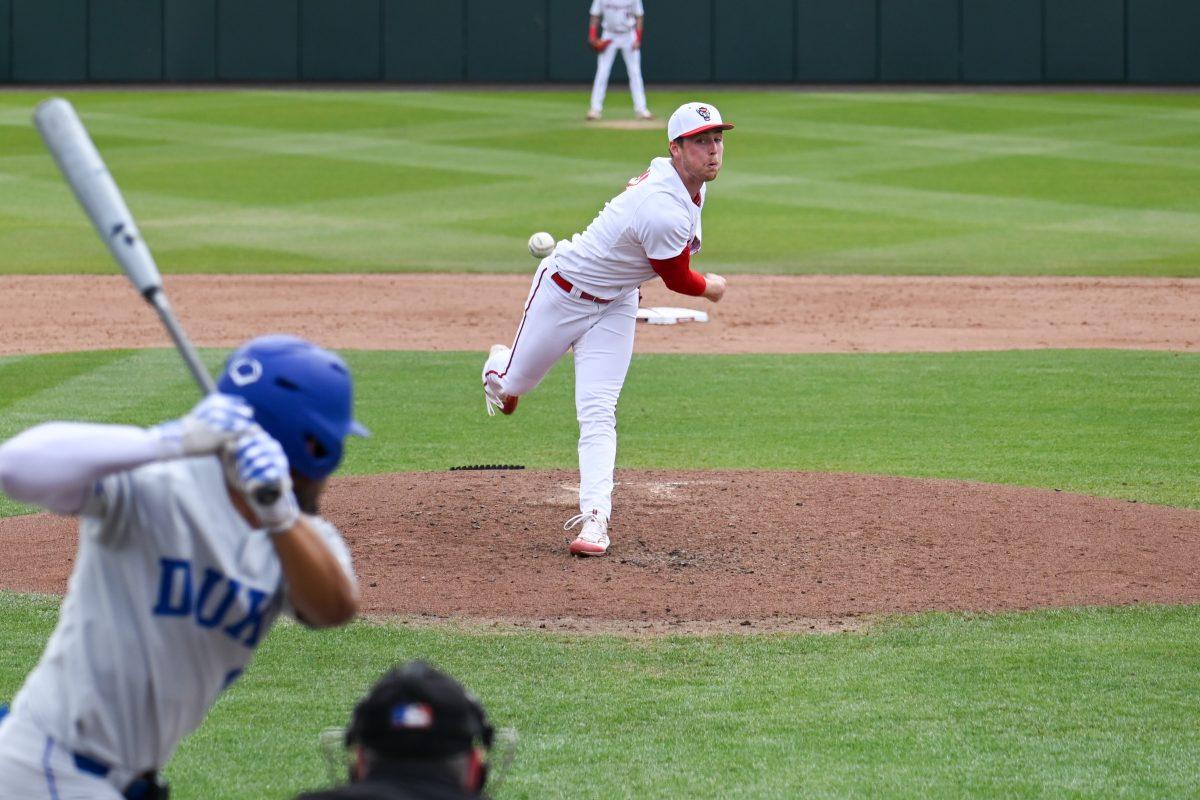 Graduate right-handed pitcher Sam Highfill pitches during the game against Duke in Doak Field at Dail Park on Friday, March 22, 2024. The Wolfpack defeated the Blue Devils 4-3.