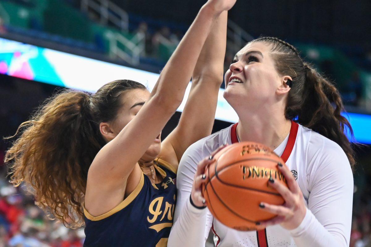 Graduate center River Baldwin eyes the net during the championship game of the ACC Tournament against Notre Dame in Greensboro Coliseum on Sunday, March 10, 2024. Baldwin made seven rebounds and one block, on top of scoring 14 points. NC State lost the game 55-51.