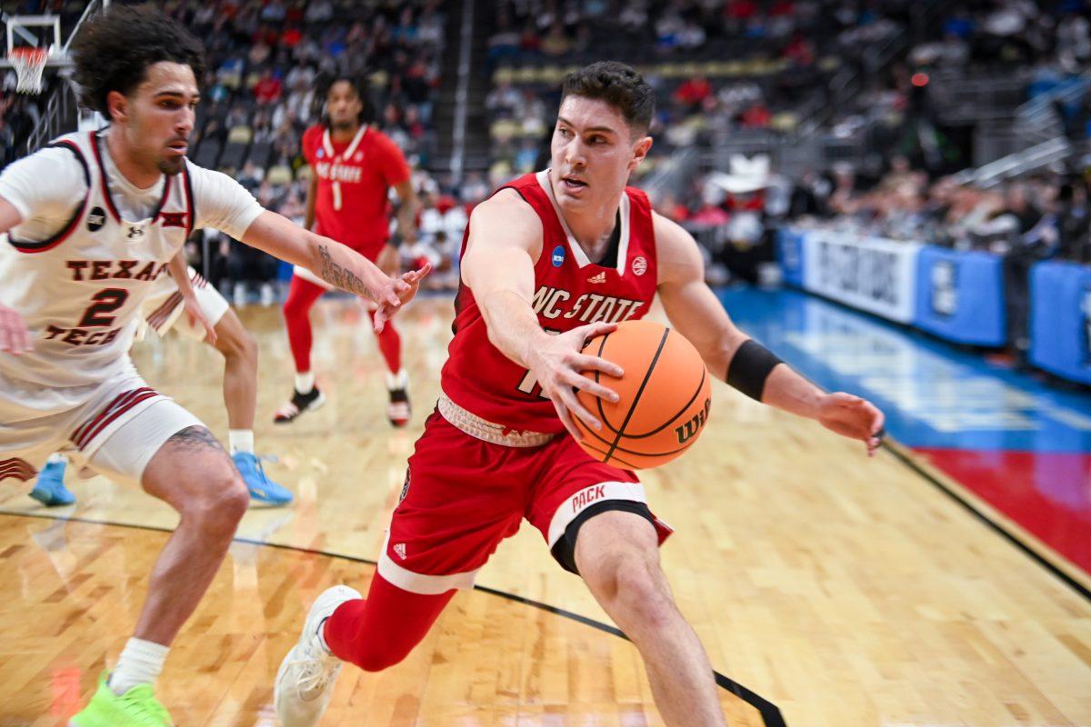 Graduate Guard Michael O'Connell grabs a loose ball during the NCAA March Madness first round game against the Texas Tech Red Raiders in PPG Paints Arena on Thursday, March 21, 2024. O'Connell had six assists and no points. NC State beat Texas Tech 80-67.