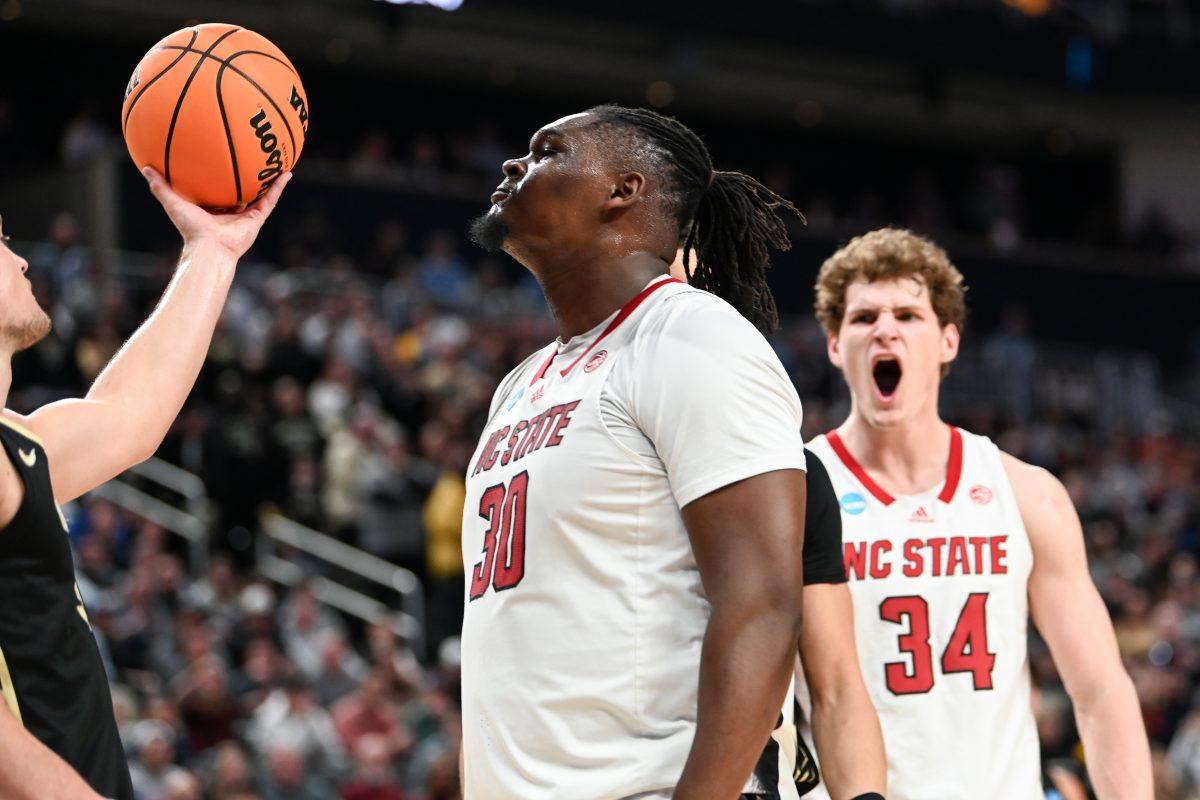 Graduate forward DJ Burns stares down his opponent after an and-one bucket during the second round game of the NCAA Tournament against Oakland at PPG Paints Arena in Pittsburgh on Saturday, March 23, 2024. Burns led in scoring with 24 points. NC State beat Oakland 79-73 in overtime to advance to the Sweet 16.