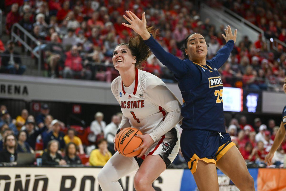 Graduate center River Baldwin tries to shoot the ball during the first round game of the NCAA tournament against Chattanooga at Reynolds Coliseum on Saturday, March 23, 2024. Baldwin scored ten points. The Wolfpack beat the Mocs 64-45.