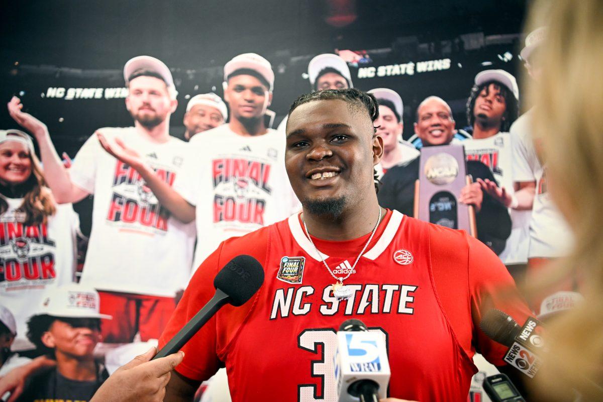 Graduate forward DJ Burns talks to members of the media in the locker room after the NCAA Tournament Final Four game against Purdue at State Farm Stadium in Glendale, Arizona on Saturday, April 6, 2024. Burns scored eight points, made four assists and one rebound. NC State lost to Purdue 63-50.