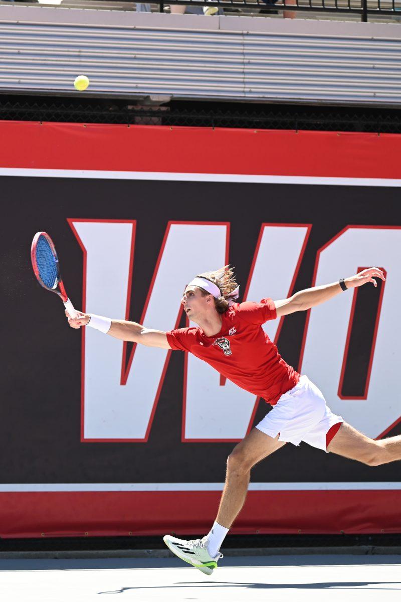 Senior Robin Catry runs to return the ball during the match against Duke at Dail Outdoor Tennis Stadium on Sunday, April 14, 2024. Carry won his doubles match. NC State beat Duke 4-2.