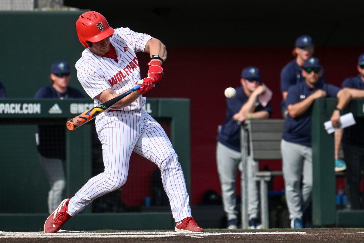 Graduate infielder Garrett Pennington hits during the game against UNC-Wilmington at Doak Field at Dail Park on Tuesday, April 30, 2024. Pennington scored one run and had one RBI. NC State lost to Wilmington 5-4.