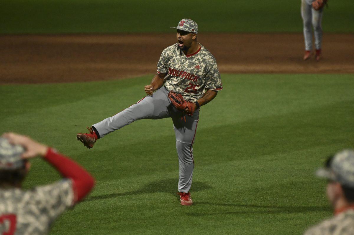 Sophomore pitcher Derrick Smith celebrates striking out the final batter during the Wolfpack's game against the James Madison Dukes in the NCAA Raleigh Regional final on Doak Field at Dail Park on Sunday, June 2, 2024. The Wolfpack beat the Dukes 5-3 to advance to the super regional round in Athens, Georgia.