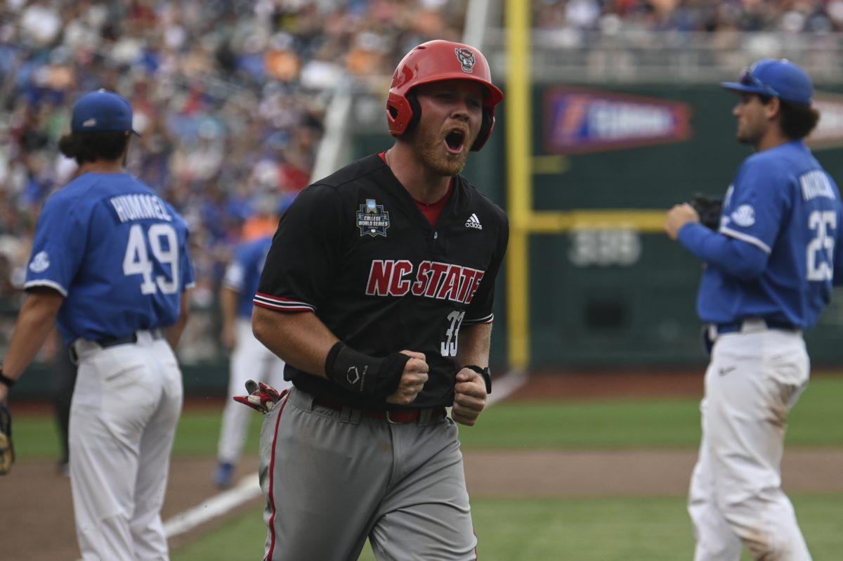 Graduate outfielder Garrett Pennington celebrates his home run against the Kentucky Wildcats during the Wolfpack's opening game of the College Men's World Series in Omaha, Nebraska, on Saturday, June 14, 2024. The Wolfpack lost to the Wildcats 5-4.