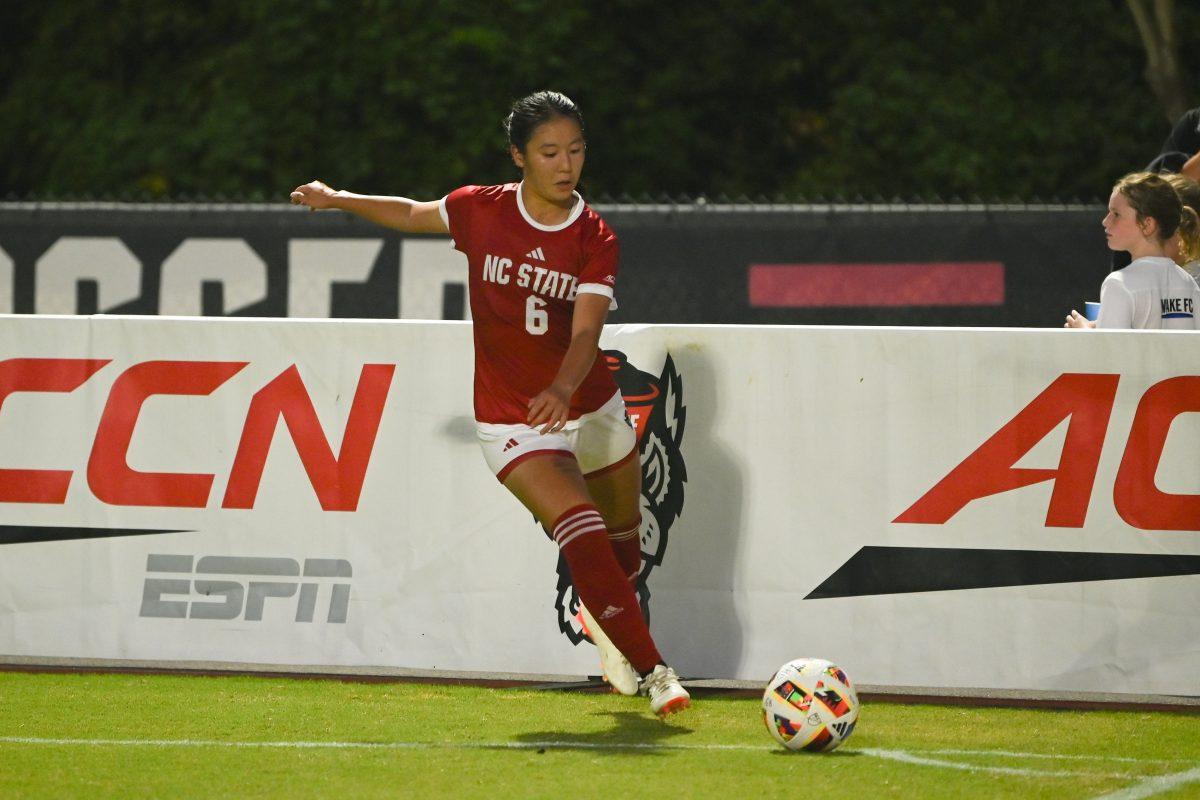 Freshman midfielder Mana Nakata crosses the corner kick during NC State's home game against Charlotte at Dail Soccer Field on Thursday, Aug. 28, 2024. The Wolfpack beat the 49ers 3-1.