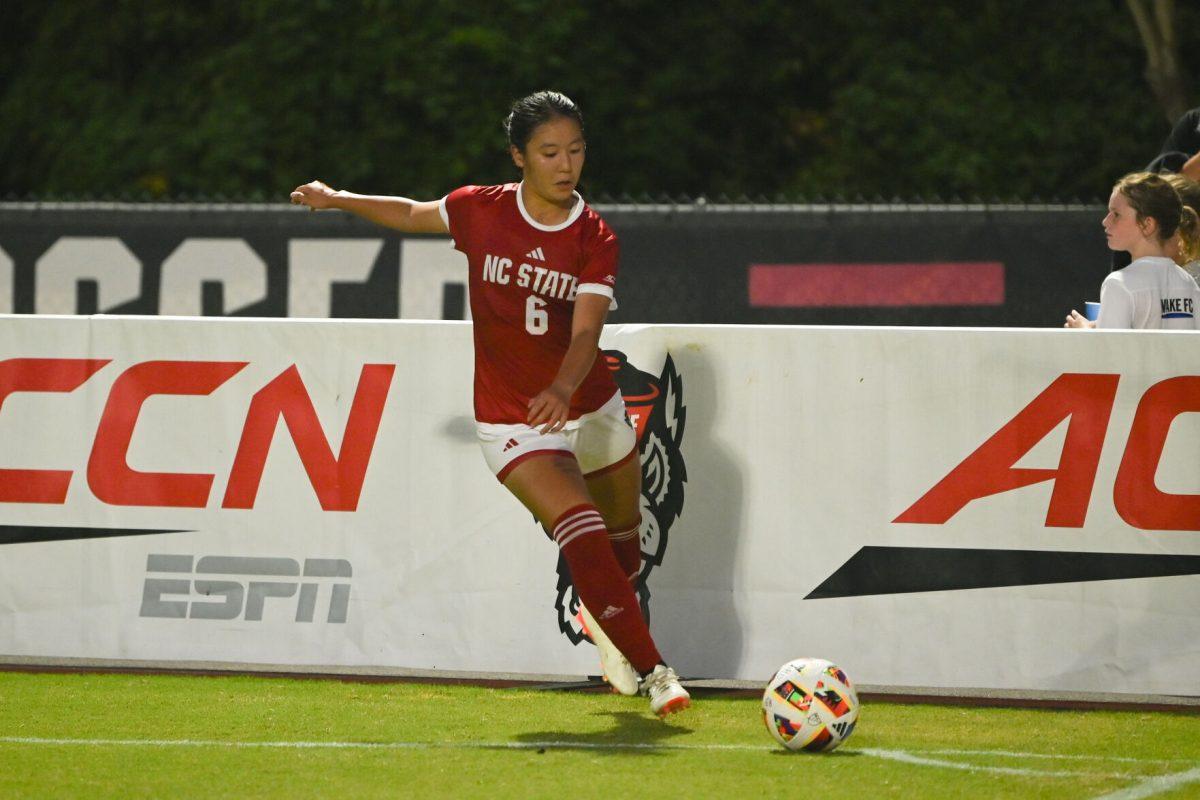 Freshman midfielder Mana Nakata crosses the corner kick during NC State's home game against Charlotte at Dail Soccer Field on Thursday, Aug. 28, 2024. The Wolfpack beat the 49ers 3-1.
