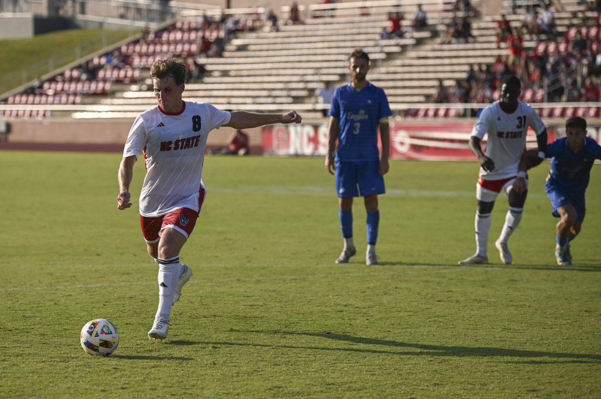 Senior midfielder Will Buete scores the go-ahead penalty during the Wolfpack's home game against the Eagles of Florida Gulf Coast at Dail Soccer Field on Sunday, August 25, 2024. The Wolfpack beat the Eagles 1-0.