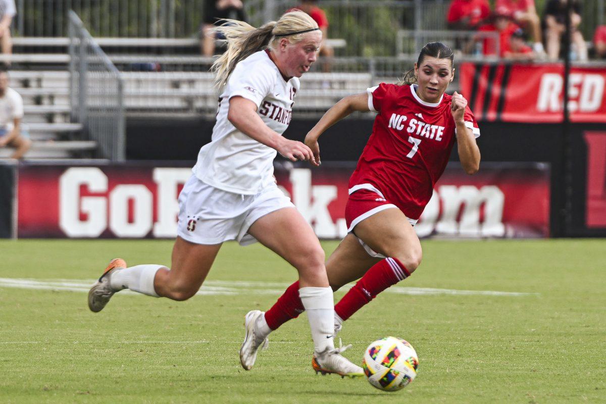 Graduate midfielder Abi Hugh races her opponent for the ball during the match against Stanford University at Dail Soccer Field on Sunday, Sept. 22, 2024. NC State lost to Stanford 2-0.