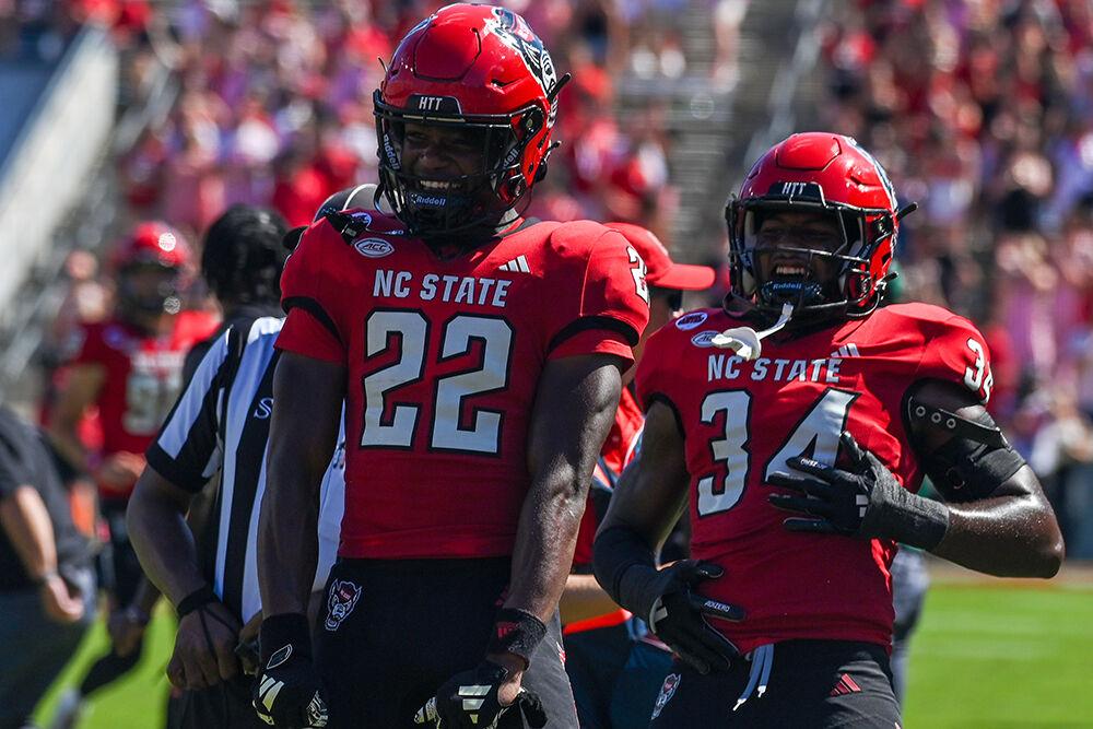 Redshirt sophomore cornerback Jackson Vick and redshirt freshman linebacker Kamal Bonner celebrate the fumble recovery during the football game against Northern Illinois at Carter-Finley Stadium on Saturday, Sept. 28, 2024. The Wolfpack beat the Huskies 24-17.