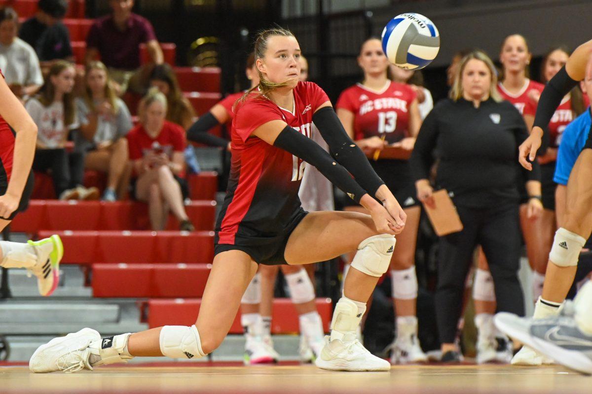 Junior outside hitter Courtney Bryant bumps the ball during the match against Liberty in Reynolds Coliseum on Wednesday, Sept. 11, 2024. Bryant made 16 digs. The Wolfpack defeated the Flames 3-1.