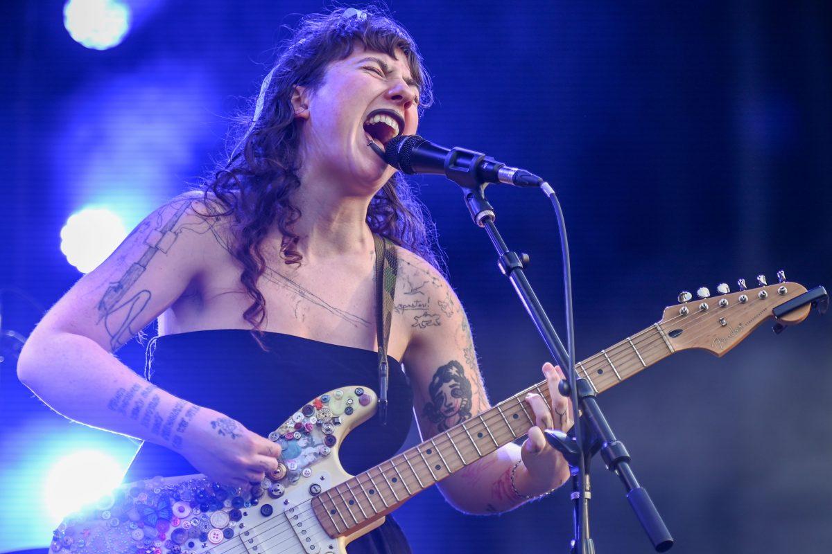 Karly Hartzman, lead singer of Wednesday, screams in to the microphone during Hopscotch Festival at Moore Square on Saturday, Sept. 7, 2024. Wednesday is an Asheville based band.