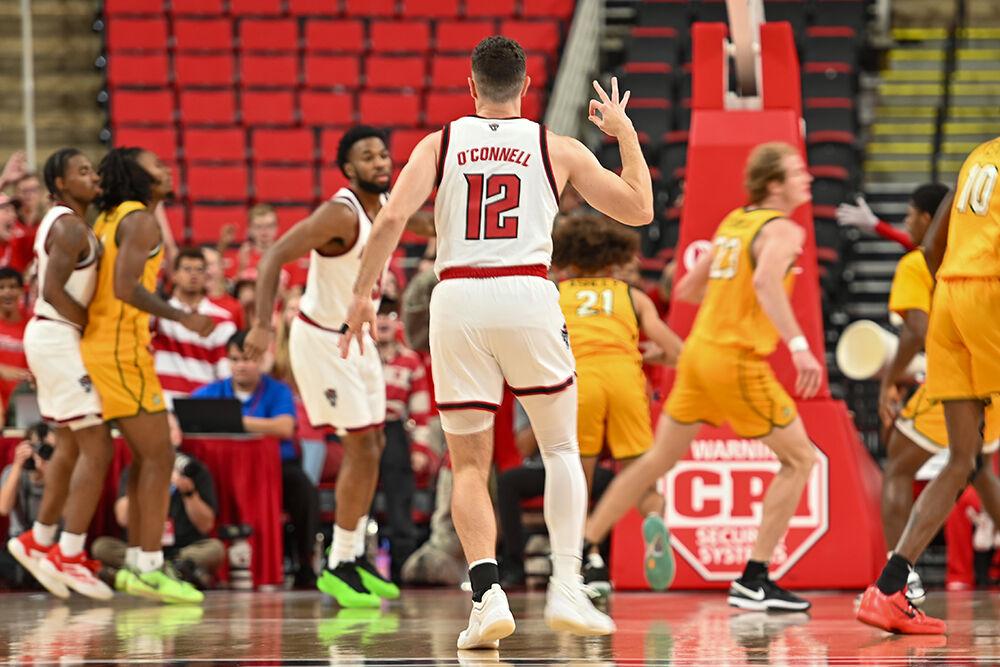 Graduate guard Michael O'Connell celebrates a 3-pointer during the exhibition game against Lees-McRae in the Lenovo Center on Wednesday, Oct. 30, 2024. The Wolfpack won 79-75 over the Bobcats.