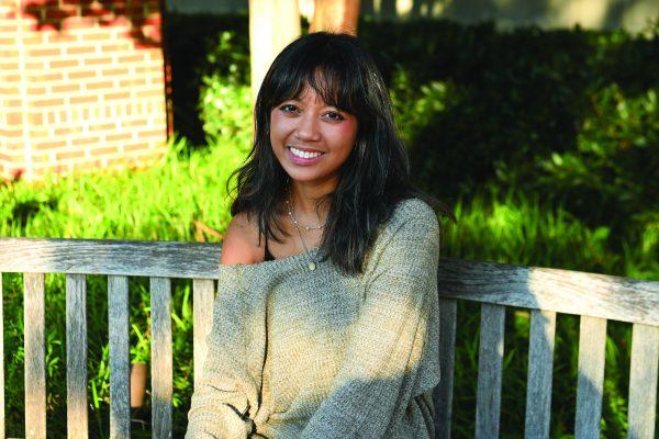 Alexis De Castro, a second-year studying fashion textile management, smiles for a portrait outside of Witherspoon Student Center on Tuesday, Oct. 8, 2024. Alexis was interviewed as a part of Technician’s “Portraits of the Pack” series, in which students were asked questions regarding their political views.  