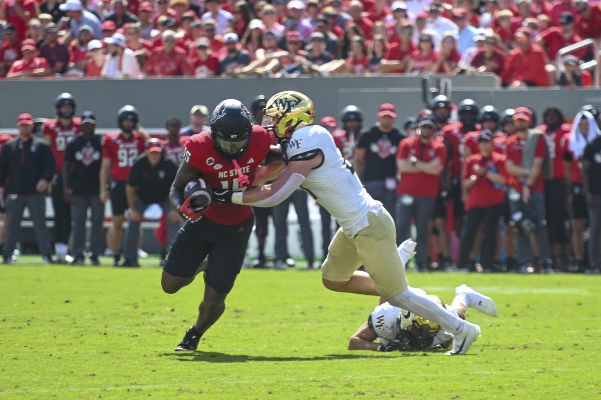 Tight end junior Justin Joly runs with the ball during the football game against Wake Forest in Carter-Finley Stadium on Saturday, Oct. 5, 2024. Joly scored one touchdown. NC State lost to Wake Forest 34-30.