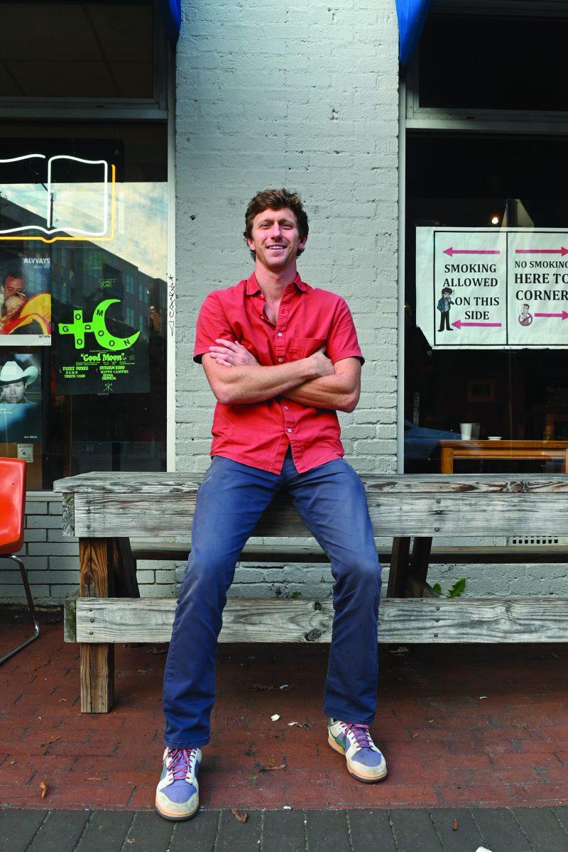 Reeves Peeler, a candidate running for an at-large seat on Raleigh City Council in 2024, sits outside of Cup A Joe on Hillsborough Street on Thursday, Oct. 3, 2024. Peeler&#8217;s hope is to build a future where Raleigh is affordable, green, walkable, safe and a place where everyone can thrive.