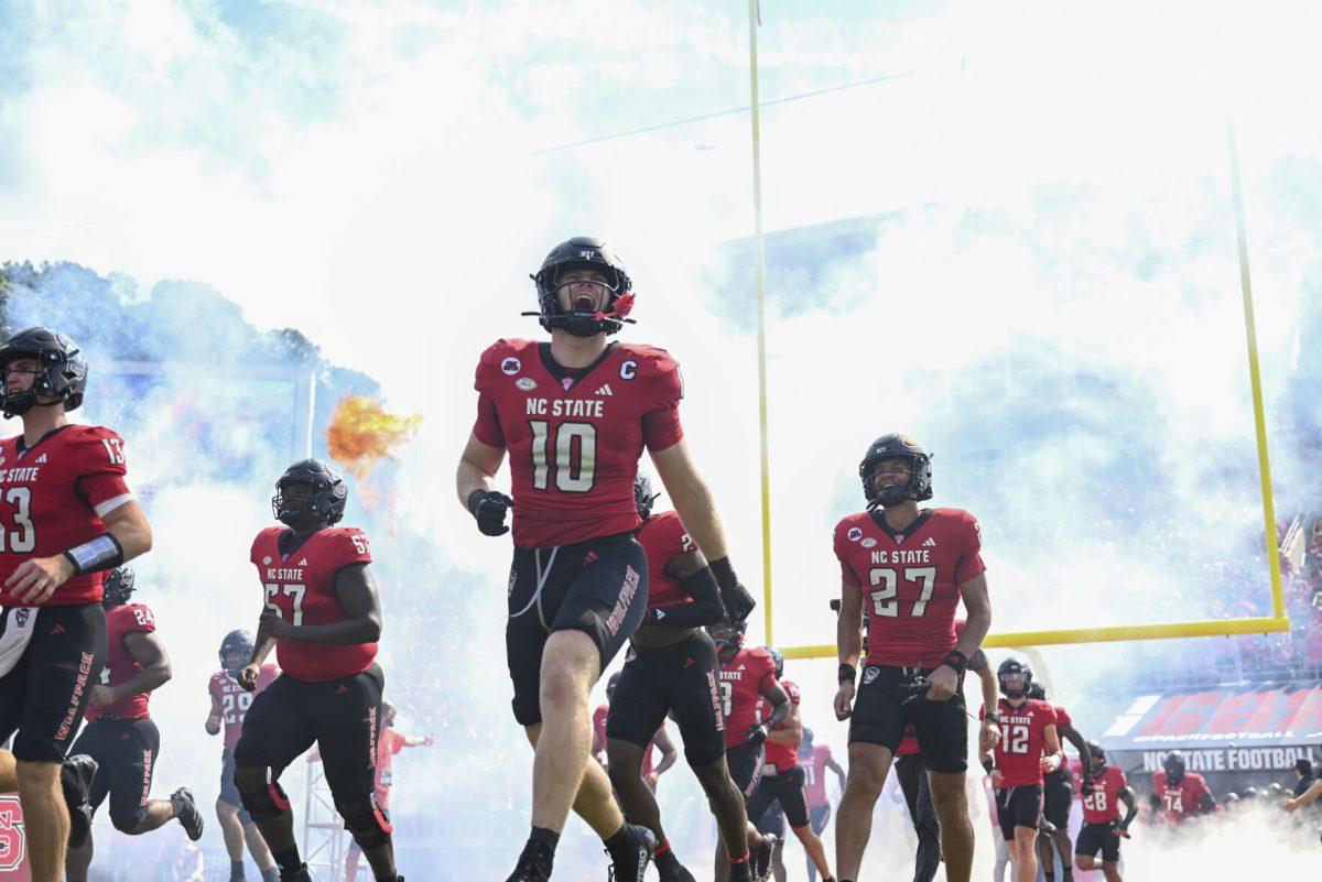 Redshirt junior linebacker Caden Fordham yells as the NC State football team runs out onto the field during the football game against Wake Forest in Carter-Finley Stadium on Saturday, Oct. 5, 2024. Fordham had three tackles and five assists. NC State lost to Wake Forest 34-30.