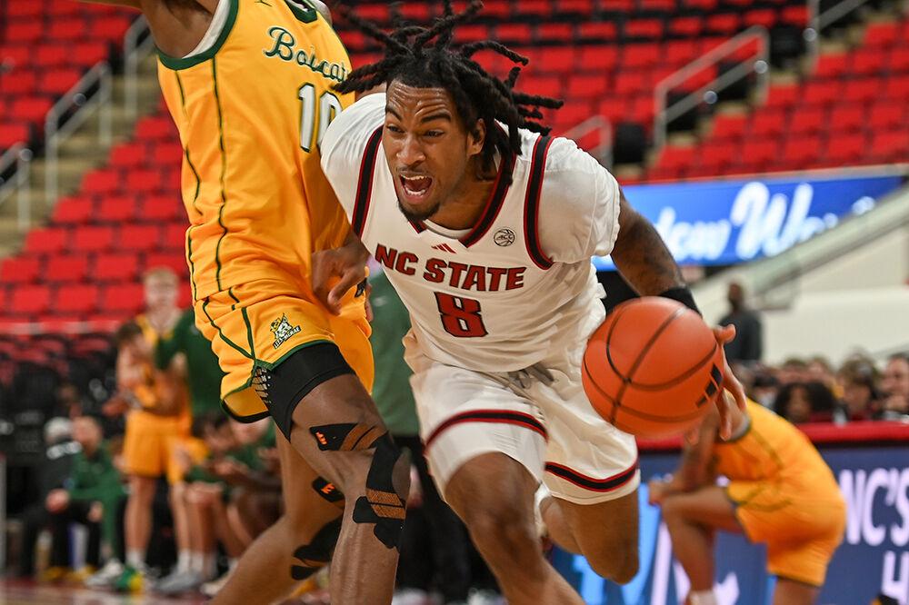 Senior guard Jayden Taylor fights through contact during the exhibition game against Lees-McRae in the Lenovo Center on Wednesday, Oct. 30, 2024. The Wolfpack won 79-75 over the Bobcats.