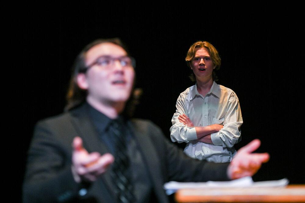 Tanner Moore, a first-year studying animal science, looks at Ryan Byung-Hoon Lim, a fourth-year studying food science, in the dress rehearsal of "Teletype" in Kennedy-McIlwee Studio Theater on Wednesday, Oct. 2, 2024. "Teletype" was a student-written production held by University Theatre.