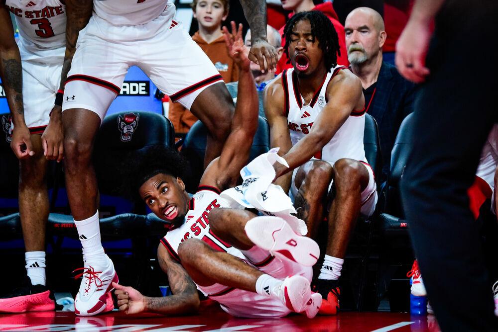 Senior guard Marcus Hill crashes into freshman guard Bryce Heard going for a loose ball during the game against William &amp; Mary in Lenovo Center on Friday, Nov. 22, 2024. The Wolfpack defeated the Tribe 81-58.