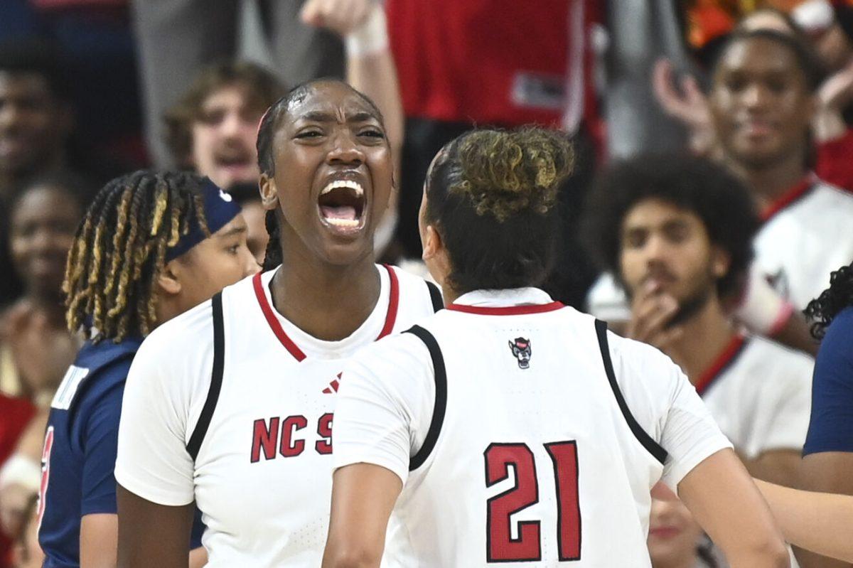 Freshman center Lorena Awou and graduate guard Madison Hayes yell during the women's basketball game against Ole Miss in Reynolds Coliseum on Thursday, Dec. 5, 2024. Awou and Hayes scored five and six points respectively. NC State beat Ole Miss 68-61.
