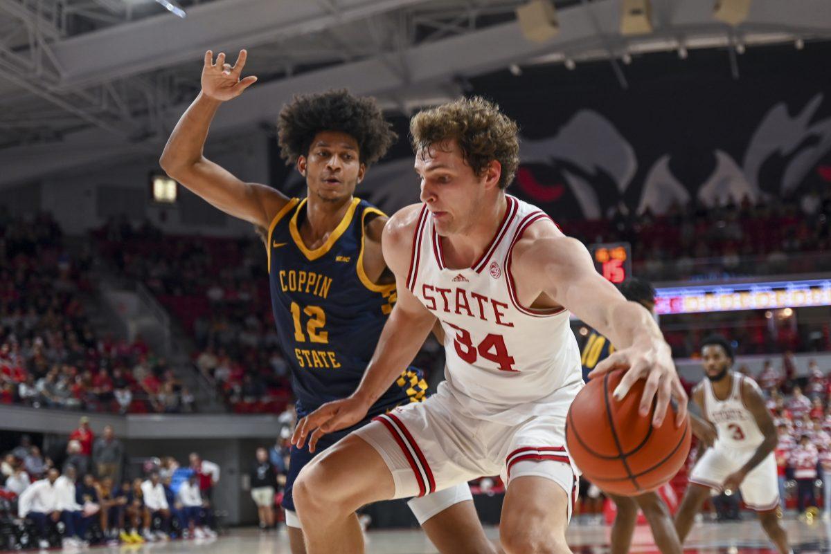 Senior forward Middlebrooks dribbles up to the goal during the men's basketball game against Coppin State in Reynolds Coliseum on Tuesday, Dec. 11, 2024. Middlebrooks scored 13 points. NC State beat Coppin State 66-56.