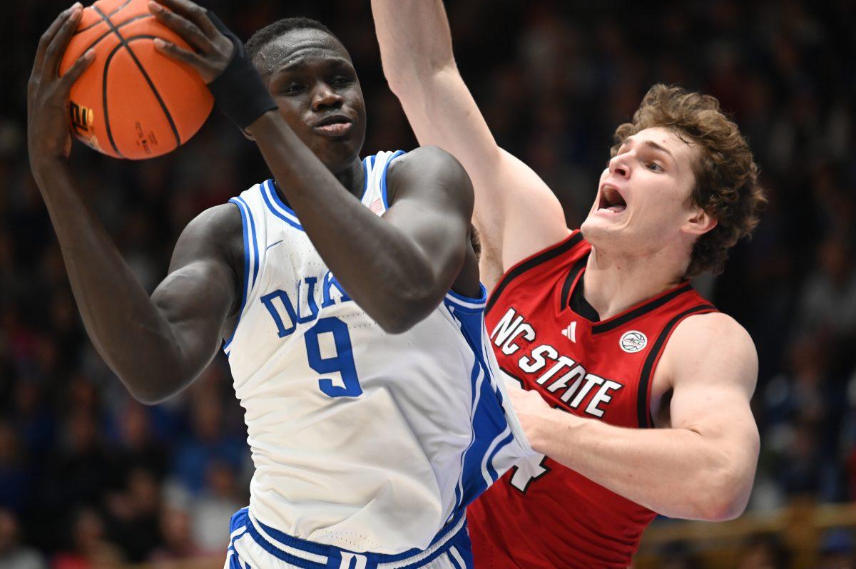 Senior forward Ben Middlebrooks battles Duke center Khaman Maluach in the paint during NC State's game against the Duke Blue Devils in Cameron Indoor on Monday, Jan. 27, 2025. The Wolfpack lead by as much as 13 in the first half but it was cut to foiur at the half. The Blue Devils beat the Wolfpack 74-64.