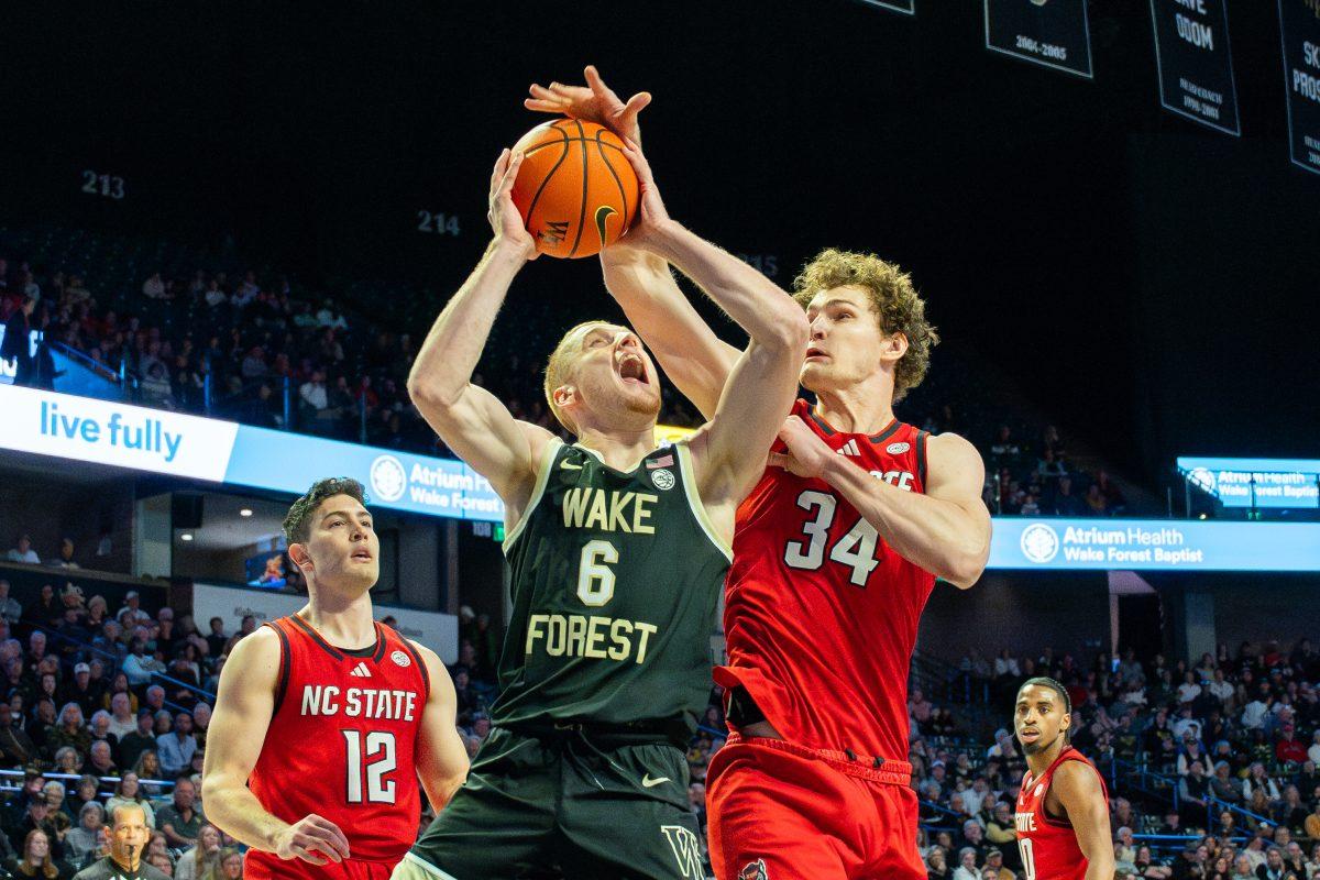 Senior forward Ben Middlebrooks blocks a shot during the game against Wake Forest University in the LJVM Coliseum on Saturday, Jan. 4, 2025. Middlebrooks scored four points and made one rebound. NC State lost the game 59-77.