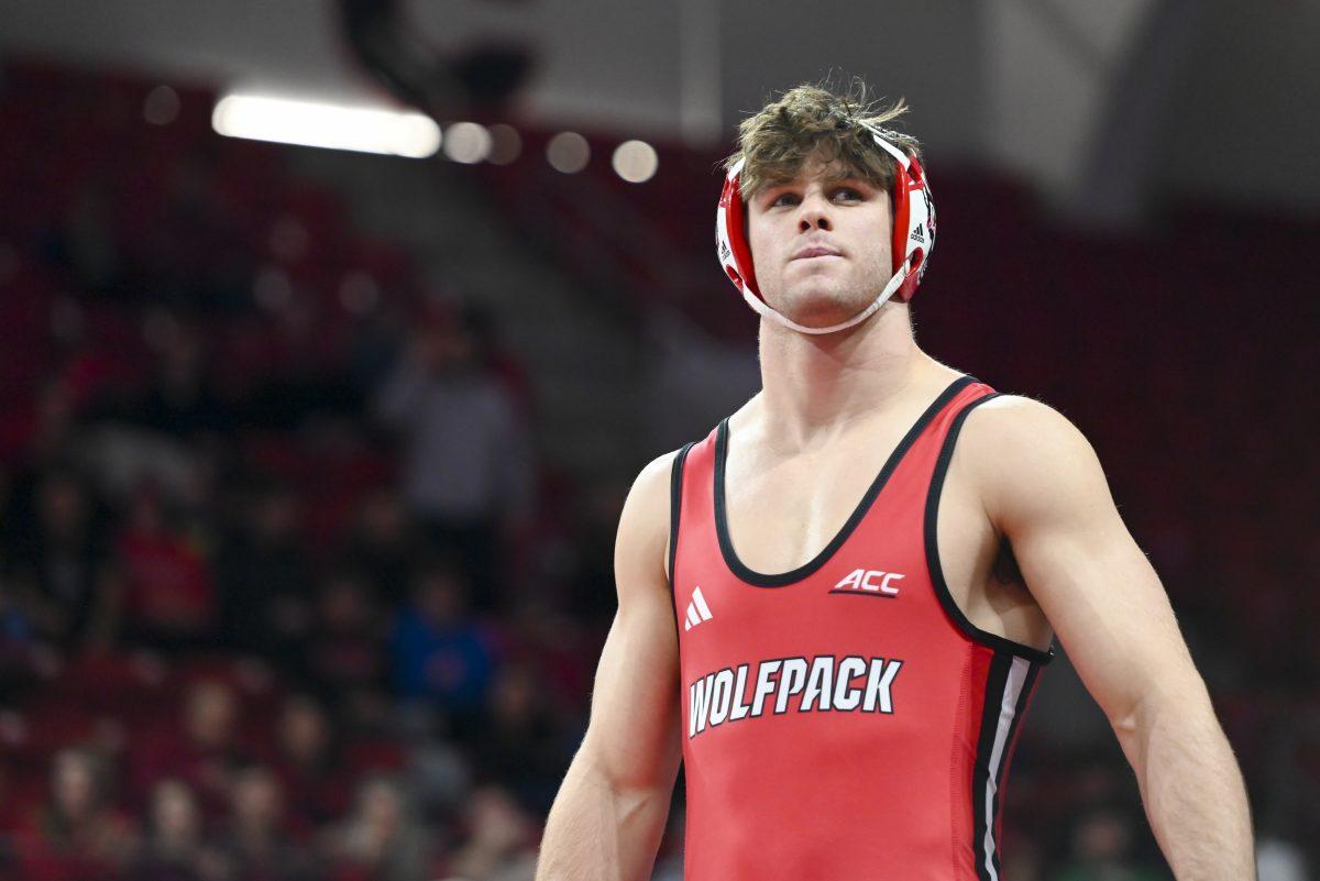 Redshirt junior Isaac Trumble prepares to go against his opponent during the duel against Duke in Reynolds Coliseum on Friday, Jan. 10, 2025. NC State beat Duke 47-0.