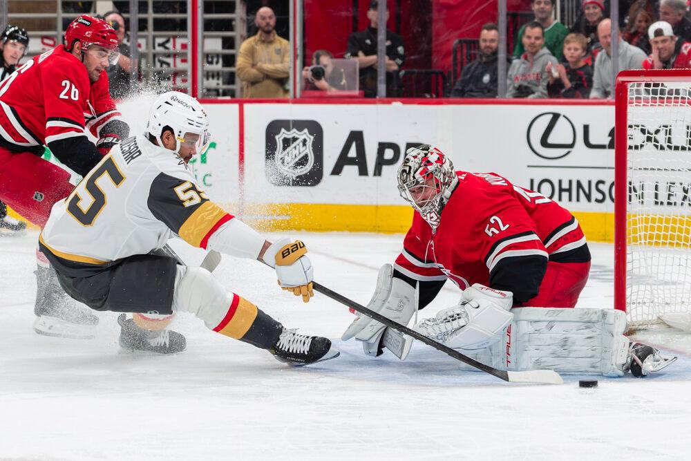 Goaltender Pyotr Kochetkov blocks a shot during the game against the Vegas Knights at the Lenovo Center on Friday, Jan. 17, 2024. The Hurricanes beat the Knights 3-2.