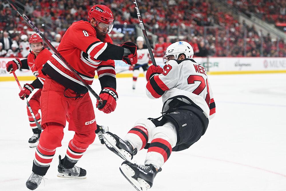 Defenseman Brent Burns pushes an opponent during the Hurricanes game against&#160;the New Jersey Devils at Lenovo Center on Tuesday, Oct. 15, 2024. The Hurricanes beat the Devils 4-2.