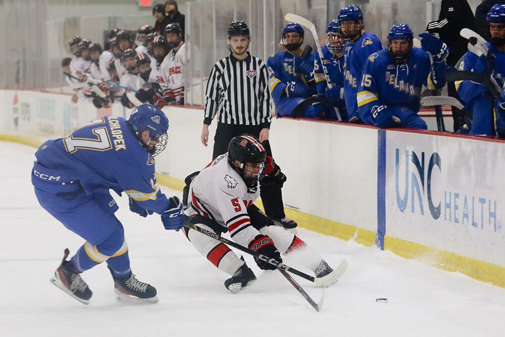 Graduate defender Ricky Frosch battles for the puck during the game against the University of Delaware at Invisalign Arena on Friday, Jan. 10, 2025. NC State beat the University of Delaware 9-1.
