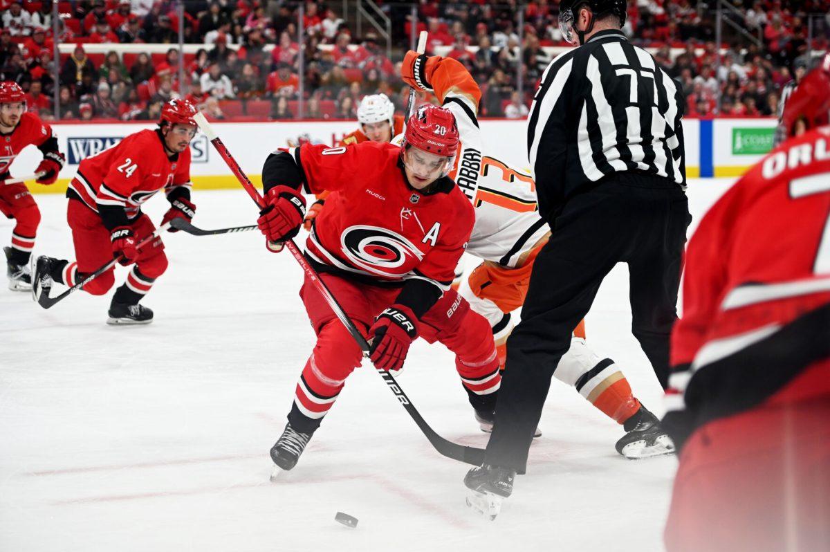 Center Sebastian Aho battles for the puck during the game versus the Anaheim Ducks at Lenovo Center on Sunday, Dec 12, 2024. The Ducks beat the Hurricanes 3-2 in overtime.