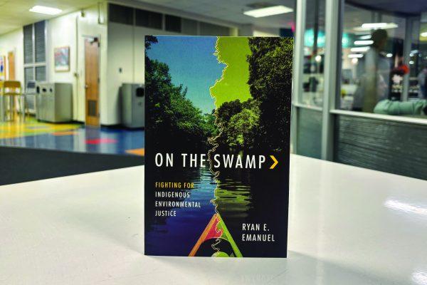 “On The Swamp,” a book by Dr. Ryan E. Emanuel sits in D.J. Hill Library on Monday, Jan. 13, 2025. The book discusses the intersection between environmental justice and Indigenous Communities.  