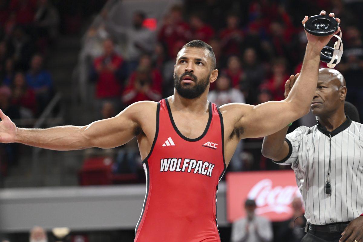 Redshirt senior Christian Knop celebrates after defeating his opponent during the duel against Duke in Reynolds Coliseum on Friday, Jan. 10, 2025. NC State beat Duke 47-0.