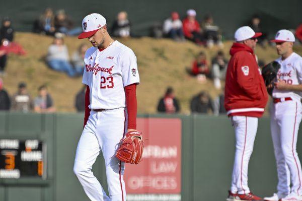 Graduate pitcher Matt Willadsen walks back to the dugout after getting swapped out during the baseball game against Liberty on Doak Field at Dail Park on Tuesday, Feb. 18, 2025. Willadsen pitched for 2.1 innings and allowed five hits and five earned runs. NC State lost to Liberty 8-9.