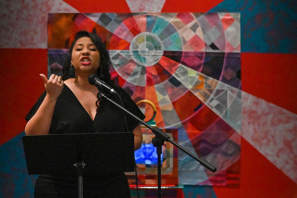 Author Khalisa Rae performs spoken word poetry at an opening exhibition by Carl Joe Williams at the Gregg Museum of Art &amp; Design on Thursday, Feb. 6, 2025.&#160;Williams' immersive exhibition titled "Amazing Grace" explores the complexities of race as a social construct.
