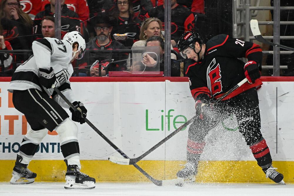 Defender Sean Walker fights for the puck during the game against the Los Angeles Kings at the Lenovo Center on Saturday, Feb. 1, 2025. Walker had one assist with three shots on goal. The Hurricanes fell to the Kings 4-2.