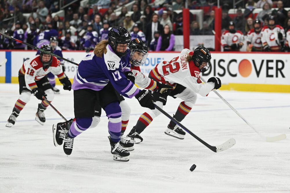 Minnesota Frost forward Brooke Bryant battles an opponent for the puck during the Minnesota Frost versus Ottawa Charge PWHL game at the Lenovo Center on Friday, March 7, 2025. The Frost beat the Charge 5-0.