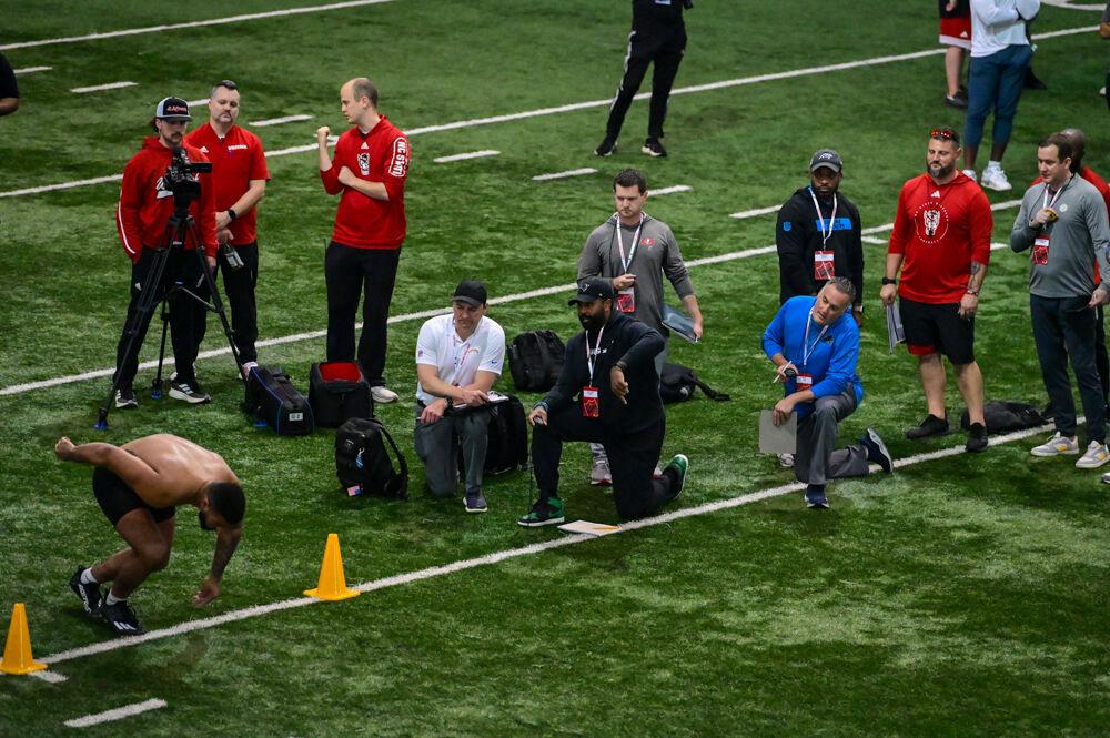 NFL Scouts watch senior defensive end Davin Vann complete a cone drill during NC State football's Pro Day in the Close-King Indoor Practice Facility&#160;on Tuesday, March 25, 2025. NC State players performed a variety of tasks in front of NFL scouts before the upcoming draft.