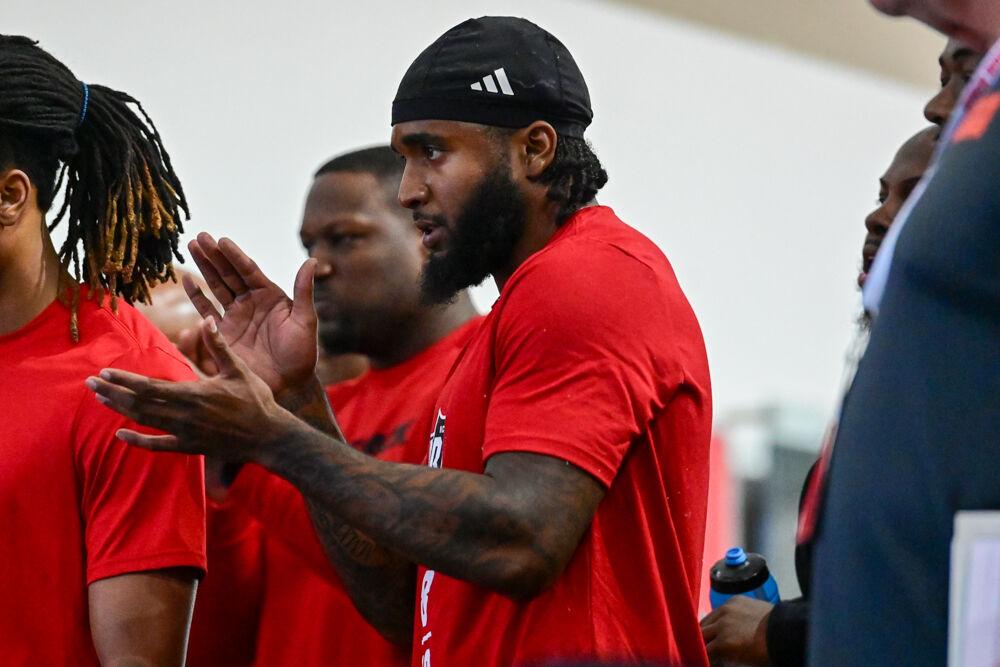 Graduate linebacker Devon Betty claps for his teammate graduate offensive tackle Anthony Belton during NC State football's Pro Day in the Close-King Indoor Practice Facility&#160;on Tuesday, March 25, 2025. NC State players performed a variety of tasks in front of NFL scouts before the upcoming draft.