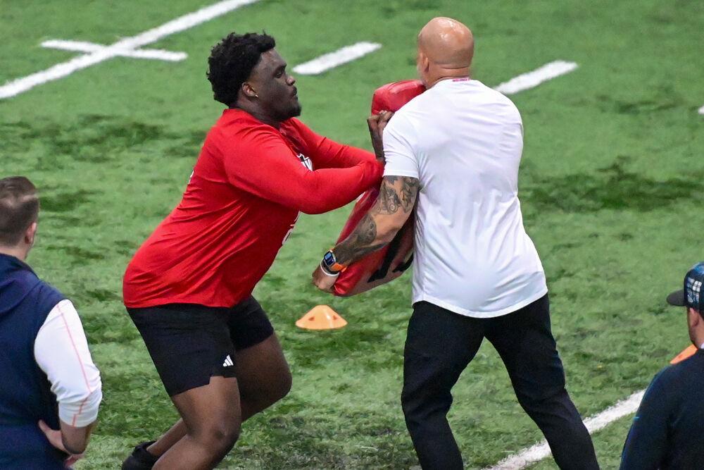 Graduate offensive tackle Anthony Belton performs an offensive drill during NC State football's Pro Day in the Close-King Indoor Practice Facility on Tuesday, March 25, 2025. NC State players performed a variety of tasks in front of NFL scouts before the upcoming draft.