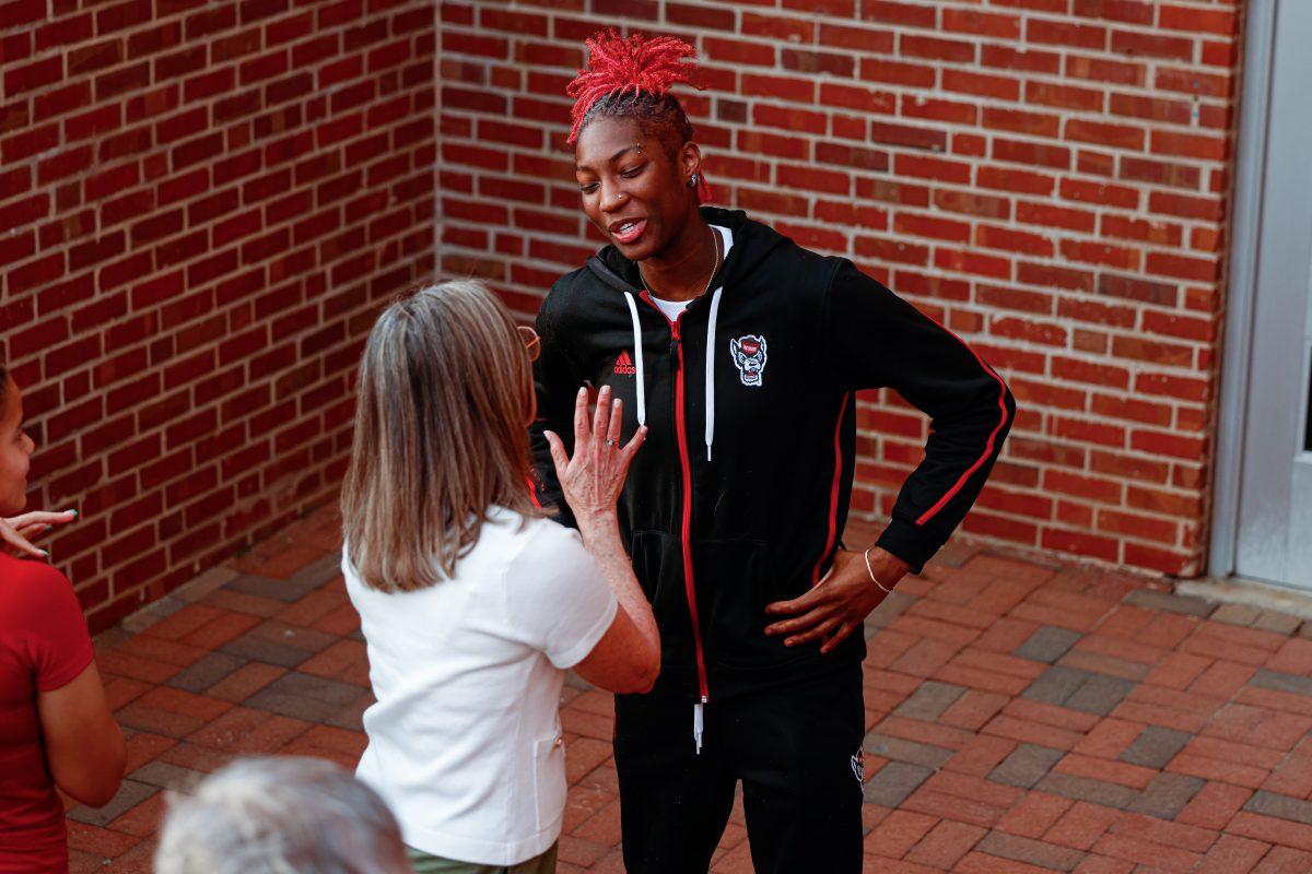 Senior guard Saniya Rivers smiles while talking with a fan during the team's welcome back to Reynolds Coliseum on Saturday, March 29. Rivers scored 415 points during her senior season.