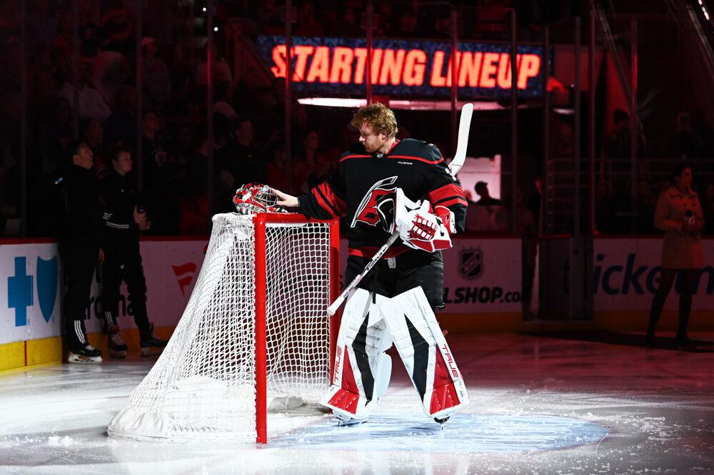 Goalie Frederik Andersen places his helmet on top of the goal during the game versus the Edmonton Oilers at the Lenovo Center on Saturday, March 1, 2025. The Hurricanes lost to the Oilers 3-1.