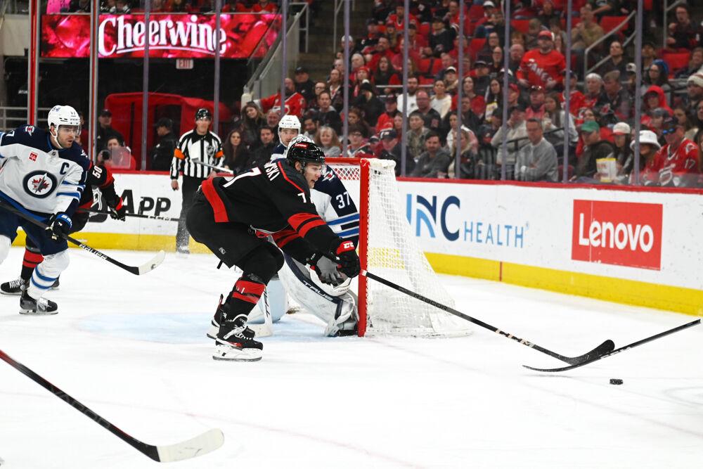 Center Mark Jankowski lunges for the puck during the game versus the Winnipeg Jets at the Lenovo Center on Sunday, March 9, 2025. Jankowski scored two goals for the Hurricanes. The Hurricanes beat the Jets 4-2.