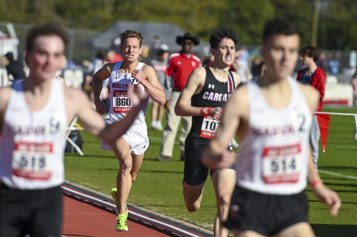 Graduate distance runner Brett Gardner pushes himself as he approach the finish line during the Raleigh Relays track meet at the Derr Track and Field Facility on Thursday, March 27, 2025. Gardner earned a personal best in the 1500m with a time of 3:42.18.