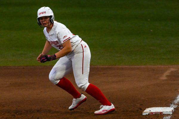 Junior catcher Hannah Church runs from first base to second while eyeing the pitch during the game against UNC-Wilmington in Dail Softball Stadium on Saturday, March 1, 2025. Church was walked twice. NC State beat UNC-Wilmington 14-1.