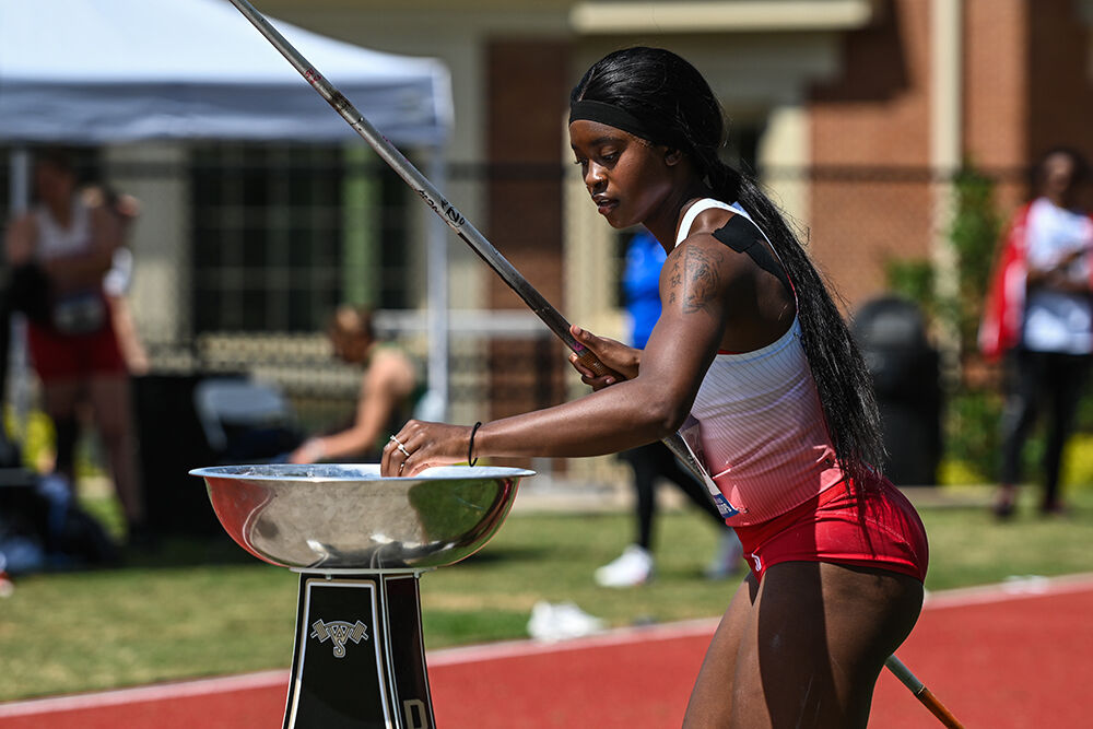 Junior Jakerra Covington applies hand chalk during the ACC Outdoor Track and Field Championships in Wake Forest University's Throws Field on Saturday, May 18, 2025. Covington threw a distance of 38.51 meters.